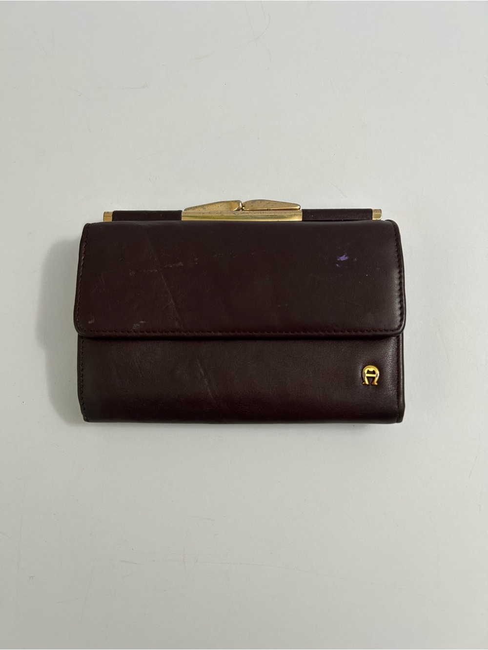 Vintage Etienne Aigner: Brown Trifold Leather Wallet with Kisslock coin section.